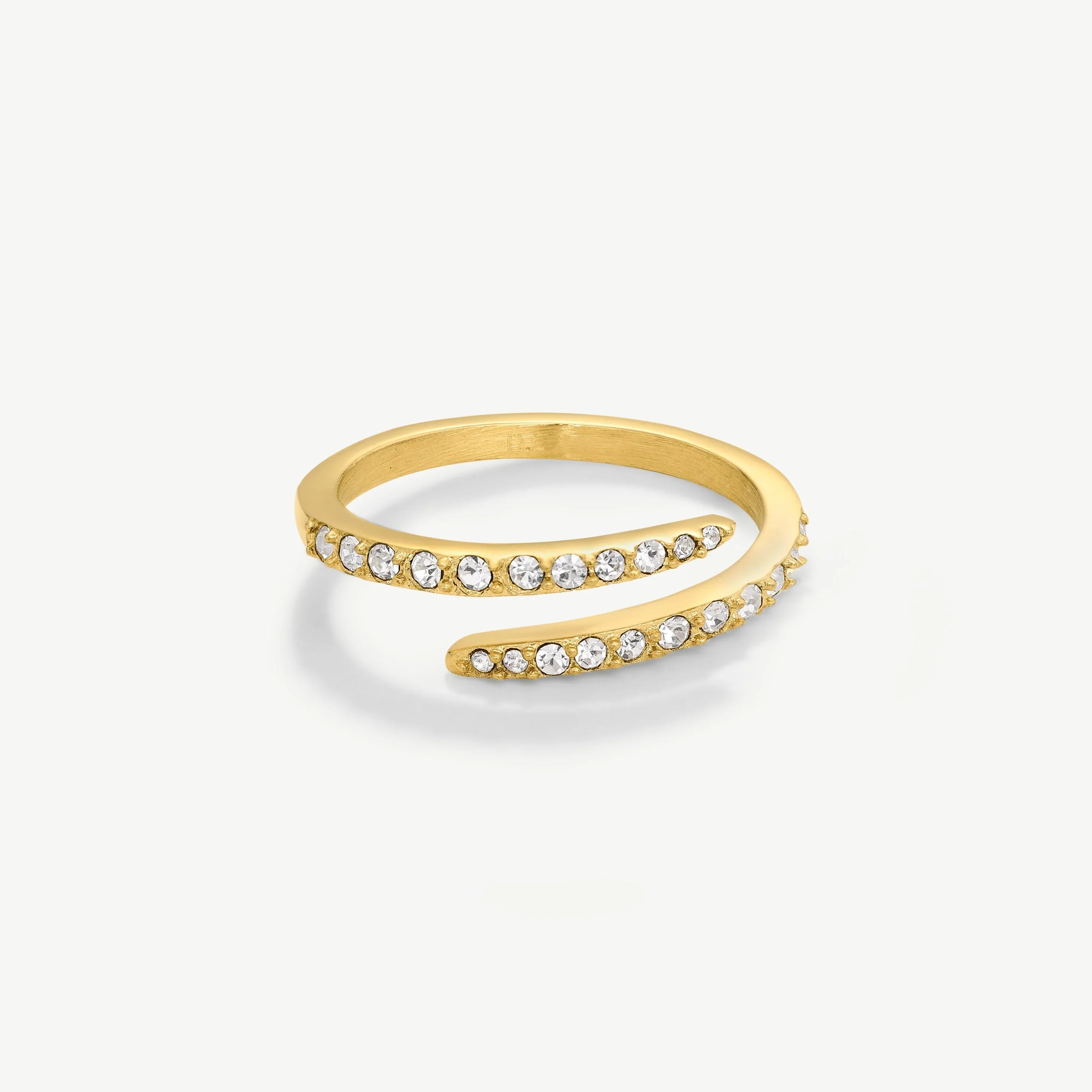 Elegant gold wrap ring adorned with clear round crystals on a white background