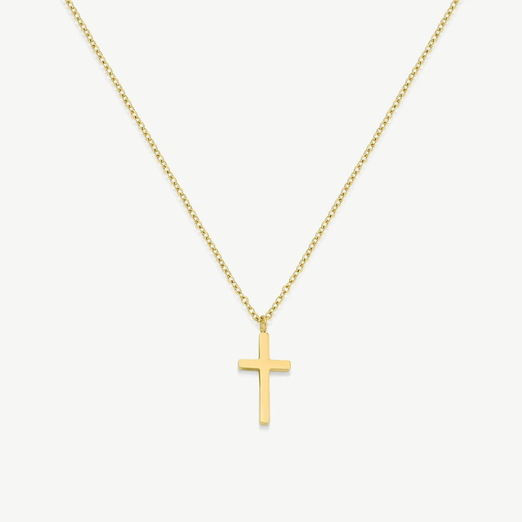 Minimalist gold cross pendant necklace on white background