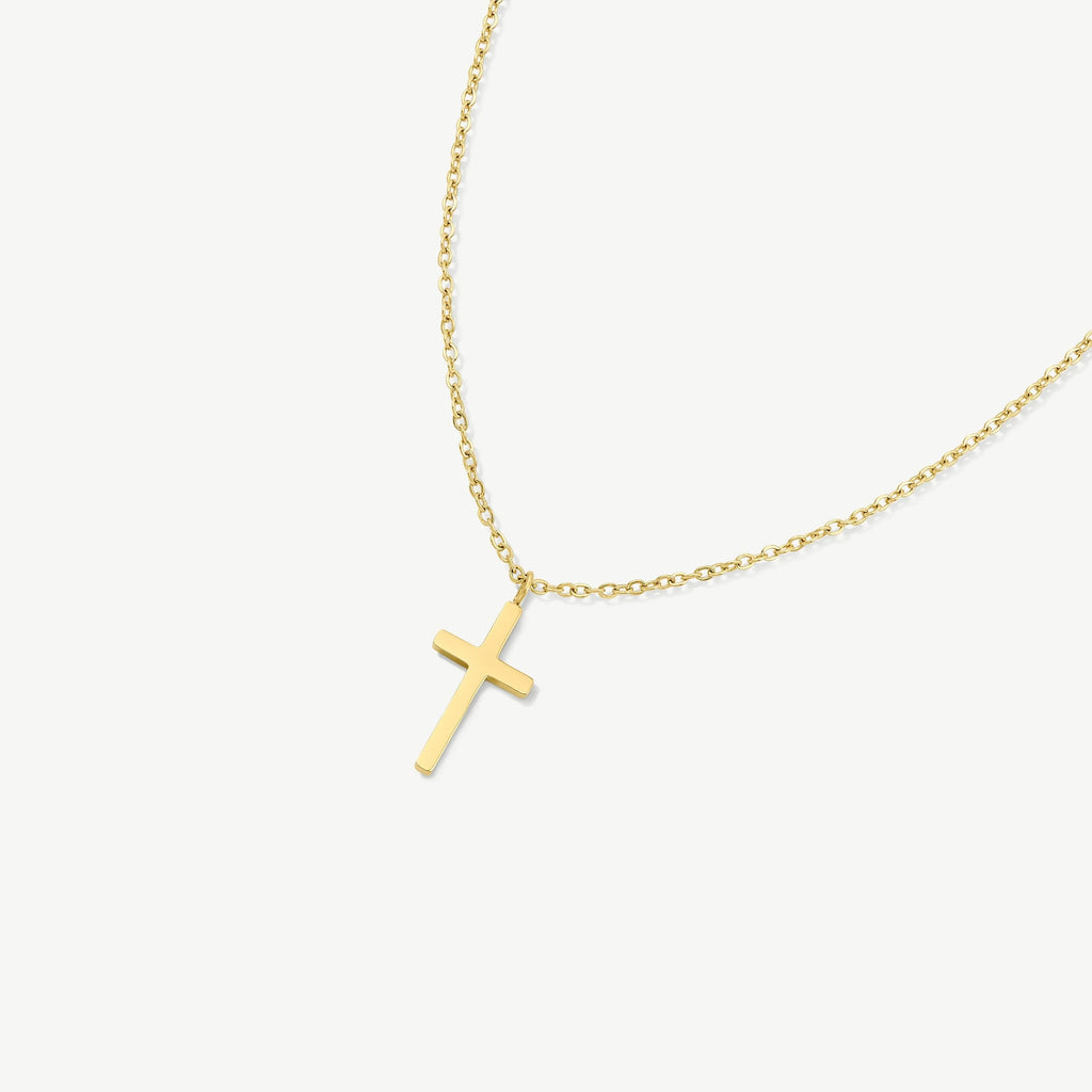 Gold chain necklace with a simple gold cross pendant on white background