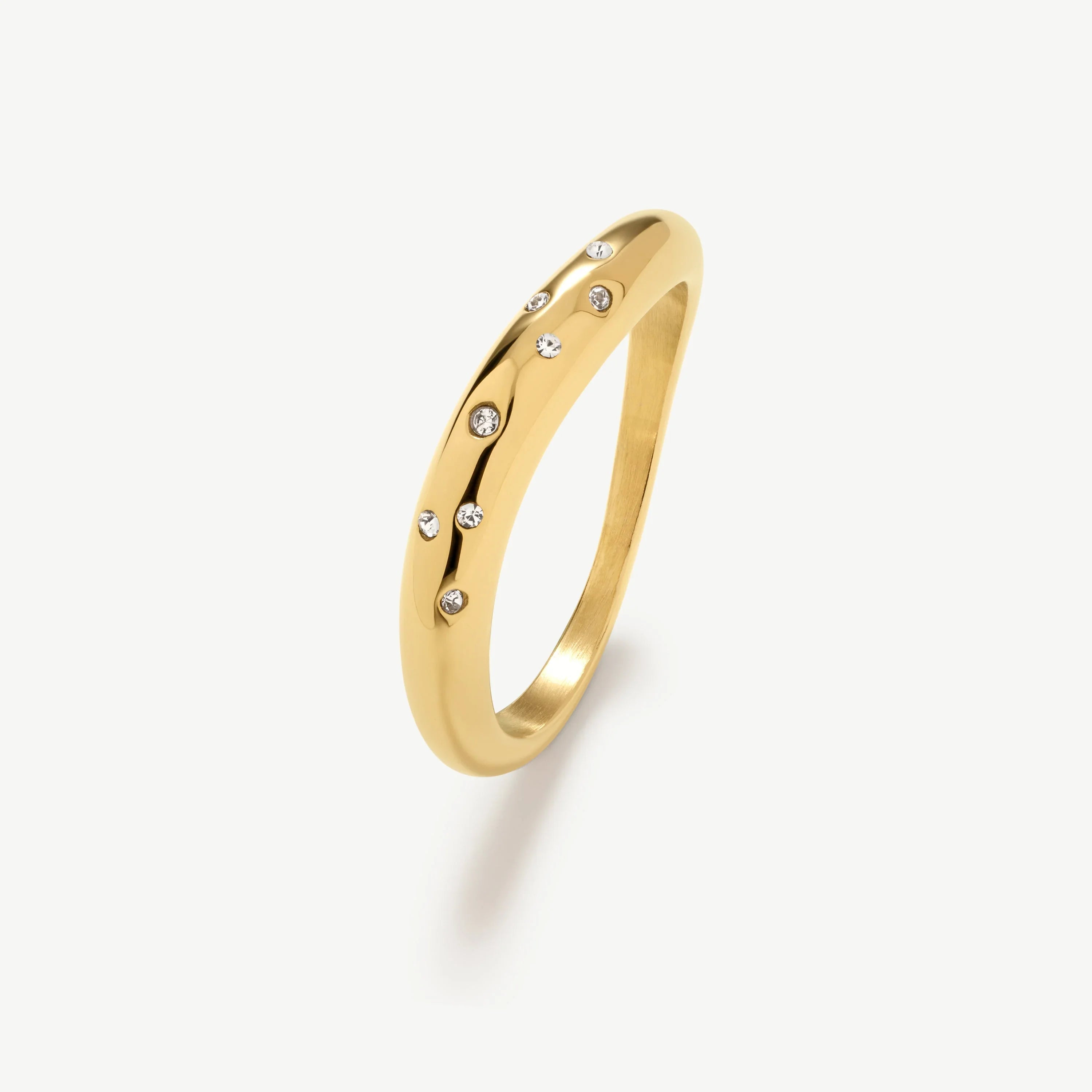 Elegant gold ring with scattered round white gemstones on polished band